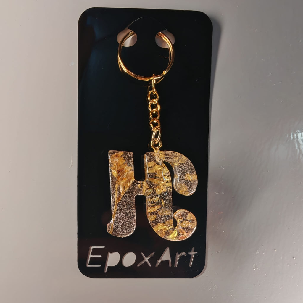 Porta-chaves Letra H em Resina – Transparente com Folhas de Ouro e Flor Preservada - 5,00 € - PORTES GRÁTIS